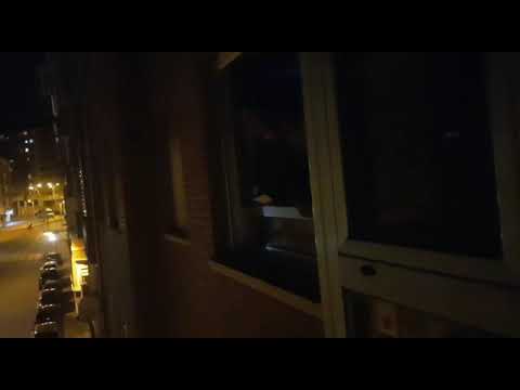 A young man sings Santa Barbara in the La Estación neighborhood and the neighbors listen in awe.