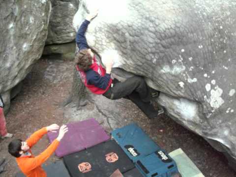 Simone bouldering in Franchard Isatis, Fontainebleau