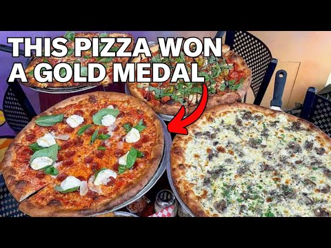 La pizzeria con UN forno, una pizza di UNA sola dimensione e una fetta da medaglia d'oro!