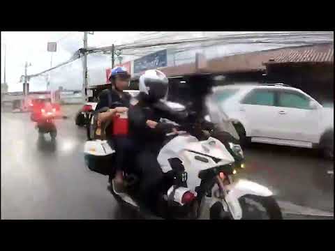 Doctor sit behind police motorcycle take heart from donor