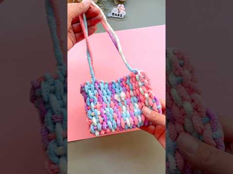 Make a loom with cardboard and let your of children experience the joy of looms