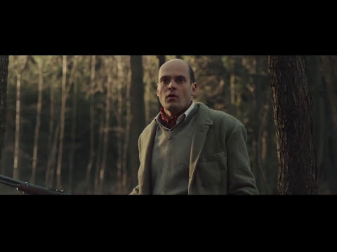 Serena official trailer still with Jennifer Lawrence and Bradley Cooper on a mountainside