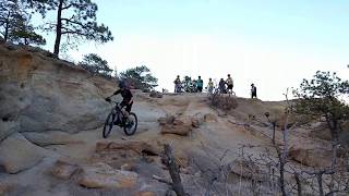 Front Rangers riding an obstacle at Palmer Park