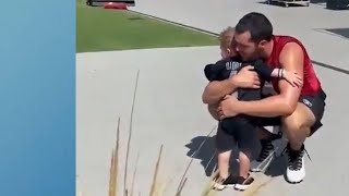 Raiders QB Derek Carr shares a hug with his adorable son at training camp