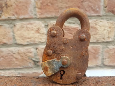 A very old and rusty padlock restoration