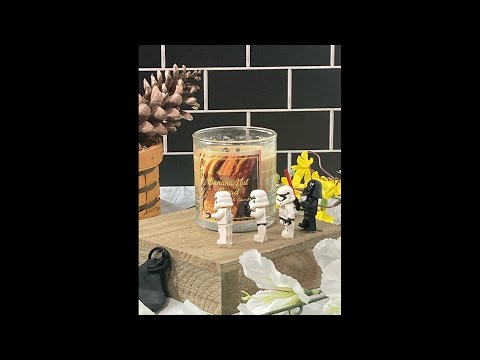 Darth Vader from Star Wars Lights a Candle with some Storm Troopers / Lego characters