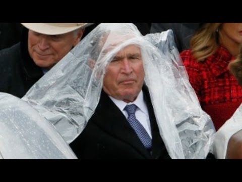 , title : 'George W. Bush struggles with his poncho at Trump’s inauguration'