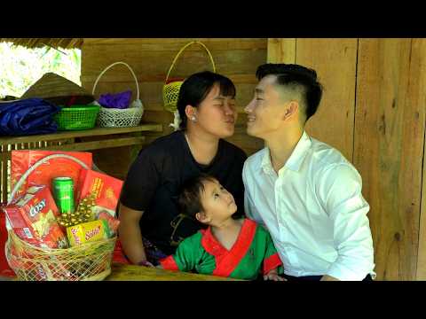 Unprecedented happiness: Tieu Dinh showers Cuong with kisses for his New Year's gift.