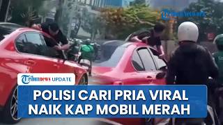 Bikin Heboh! Polisi Selidiki Aksi Pria Bergelantungan di Mobil Merah Viral di Jakarta Barat