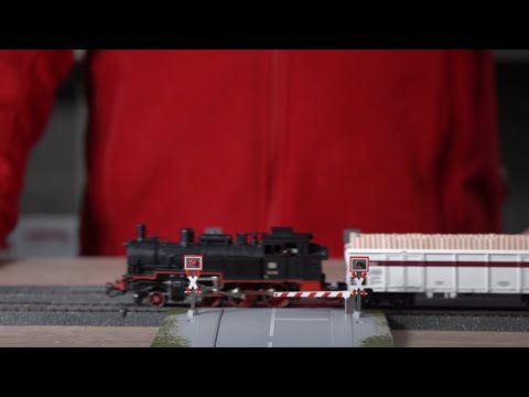 Vollautomatischer Bahnübergang (74924) für Märklin C-Gleis / Anschluss und Einbau