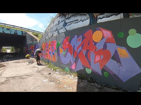 Graffiti - Full color graffiti pieces under the bridge
