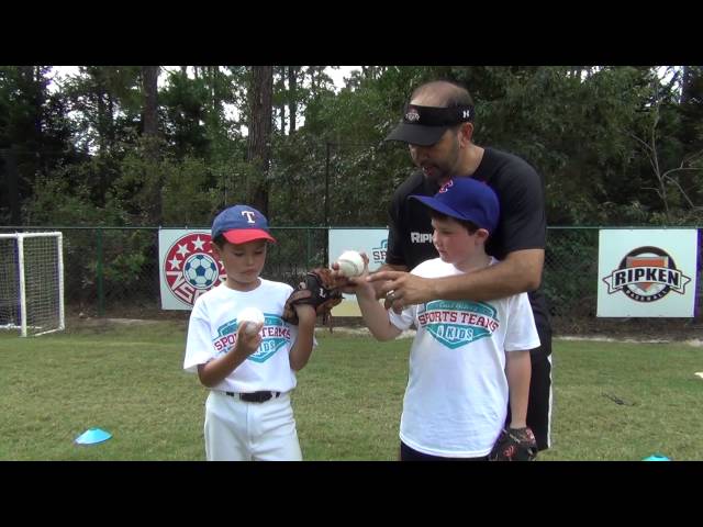 How should an 8 year old grip a baseball?
