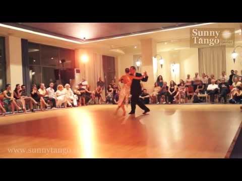  Lorena Ermocida  and  Oscar Martinez Pey  are  dancing  to  the  tango  "  A Los Amigos  "  by  Osvaldo Pugliese  at  Sunny Tango Festival  in  2013