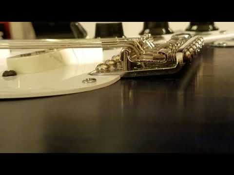 Strat bridge lifting up? It's quick and easy fix...