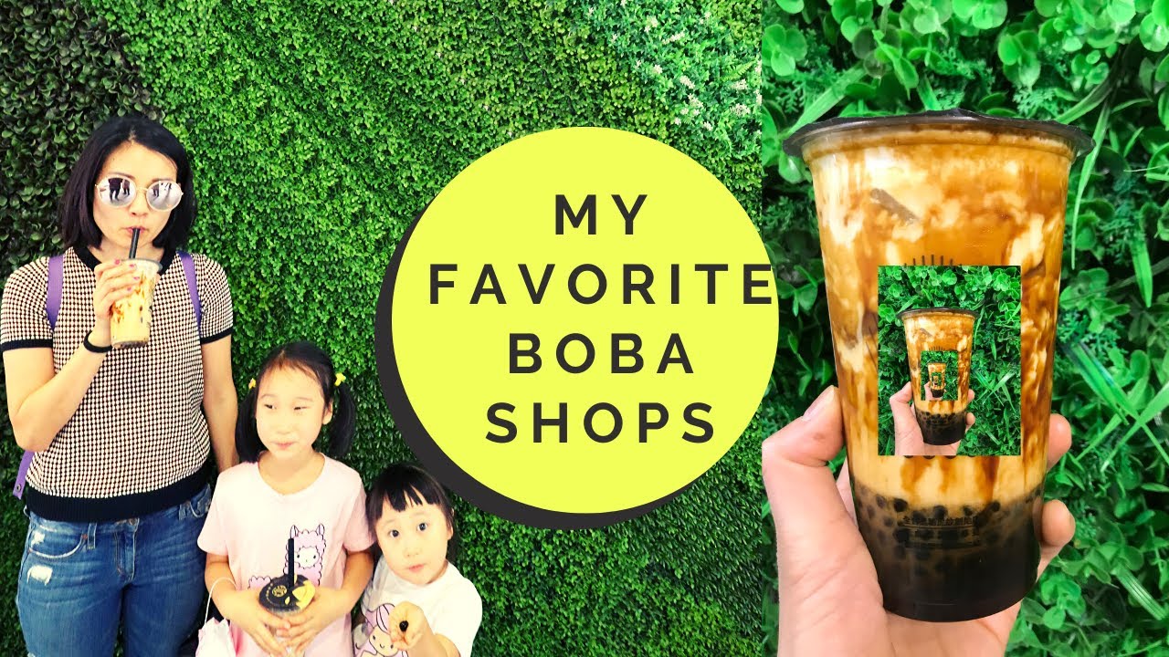 A row of Korean bubble tea cups with colorful drinks and tapioca pearls displayed at a popular boba shop in Seoul