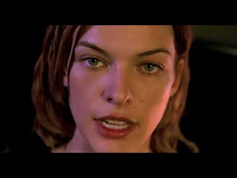 Trailer still — S.T.A.R.S. stand-off with Nemesis; guitars in the marketing, orchestra in the movie