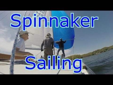 Sailing a J22 under a Bright Blue Spinnaker