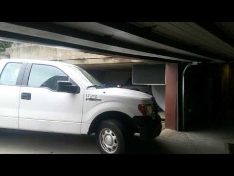 GAJIC truck 12- 212 entering garage at "Tiffany South" 5019 Mulford St. Skokie