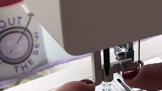 How to use the automatic needle threader on a Janome sewing machine