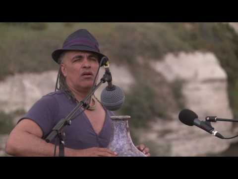 Mino Cinelu playing Udu with a thunderstorm. Cappadocia, Turkey