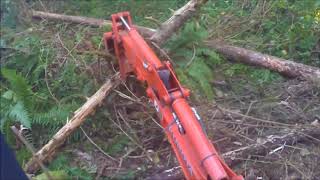 Trail Building Grading and Leveling, Using the Backhoe Thumb With the Kubota BX25 Trail Building Grading and Leveling, Using the Backhoe Thumb With the Kubota BX25