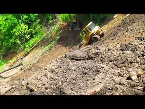 D5 dozer sliding down steep mountian
