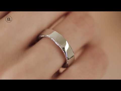 0.70 carat eternity ring in white gold with small round diamonds on the side