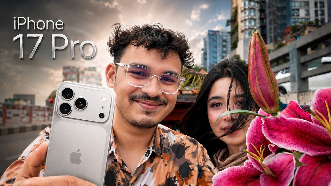 Mahdi holding a white iPhone 17 Pro beside his girlfriend and pink lilies