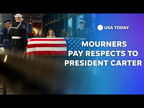 Mourners pay respects to President Jimmy Carter