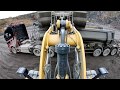 A Day At Work Caterpillar 972M XE Wheel Loaders Loads Truck And Dumpers