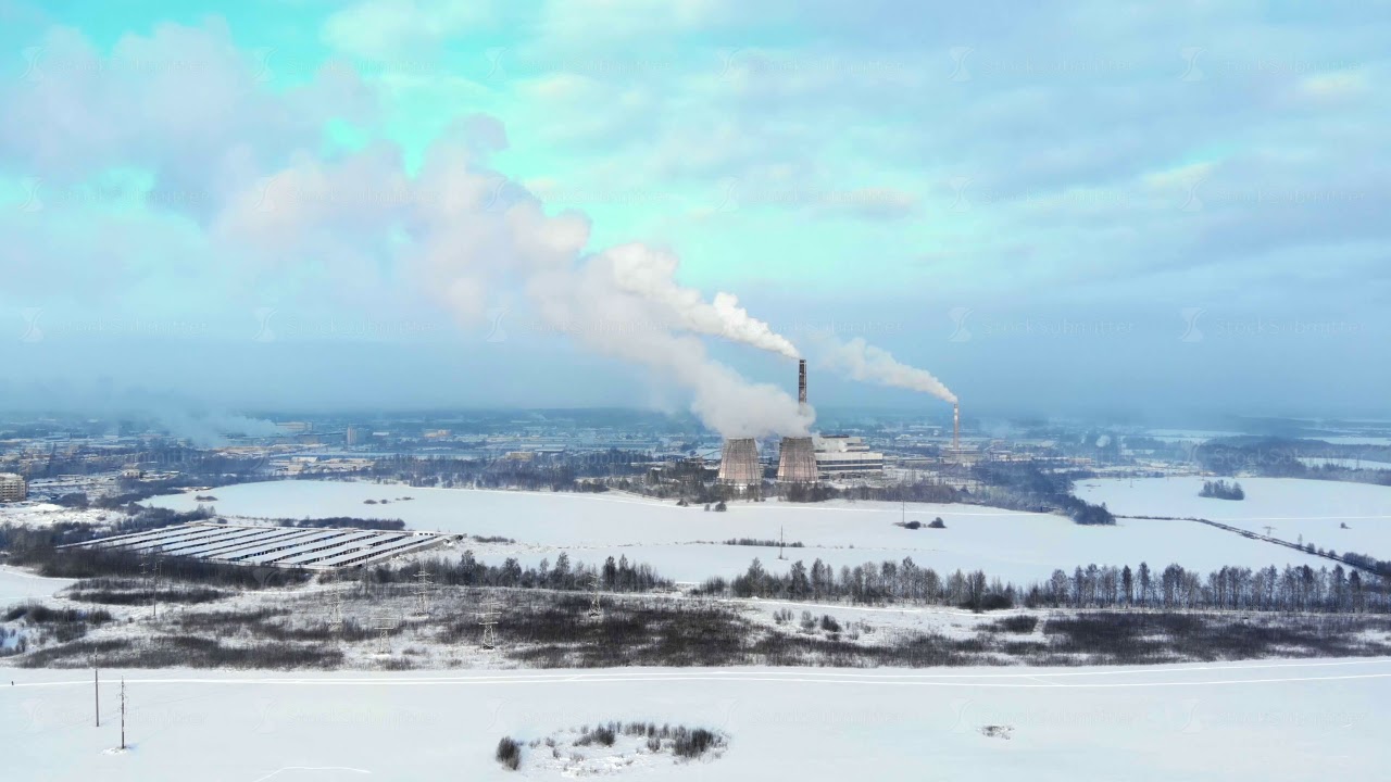 Drone view smokestacks on industrial area at heating plant. Boiler pipe and smoke