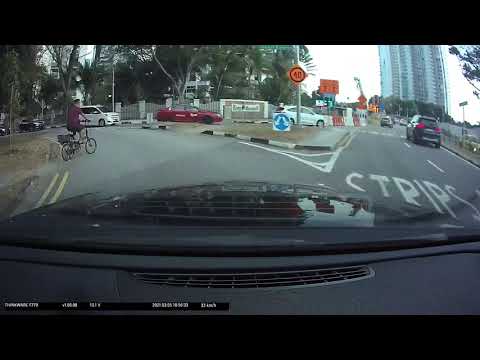Driving in Singapore: Cyclist not keeping a proper look out for traffic #shorts