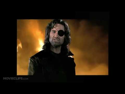 Escape from L.A. official trailer frame: Snake Plissken surveying ruined Los Angeles at dusk