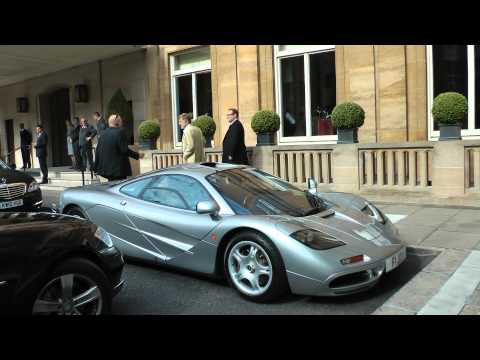 Hollywood actor Robert Redford admiring a Mclaren F1