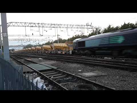 The very lengthy Network Rail HOBC (High Output Ballast Cleaner) powers through Colchester at speed