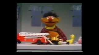 Sesame Street - Ernie puts away his toys - fire engine