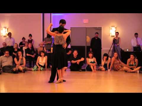  Dana Frigoli  and  Adrian Ferreyra  are  dancing  to  the  nontraditional song  "  Vuelvo al Sur  "  at  Chicago Tango Week  in  2014
