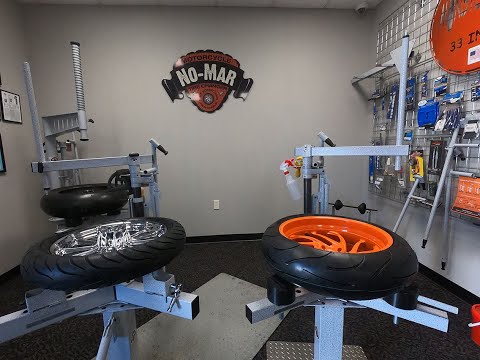 No-Mar Tire Changers - Dog and Cam Blocks Vs Posi Clamps