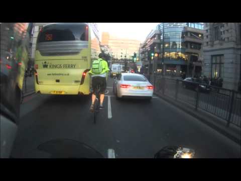 Cyclist has a close call with a coach, pedal fail.