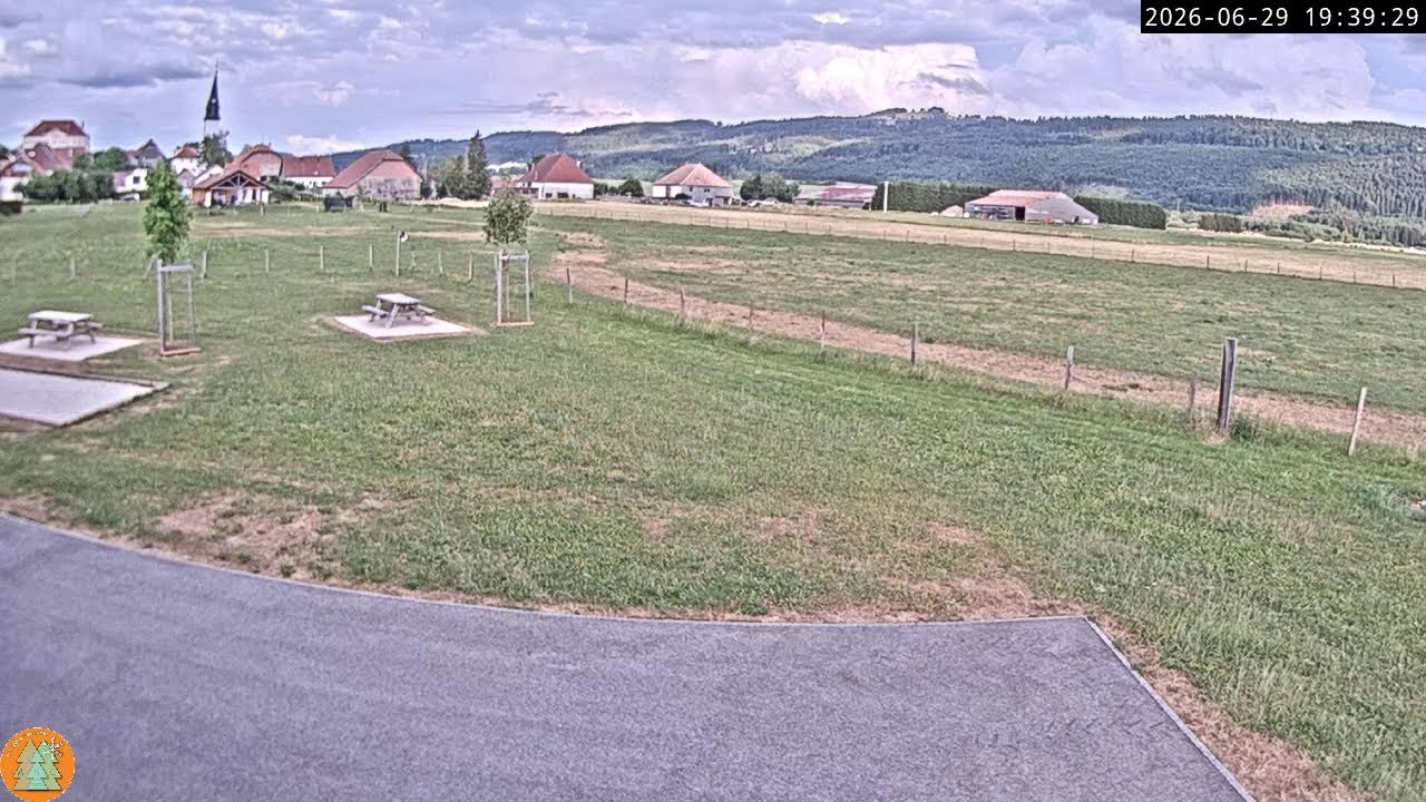Live webcam view of Arc-sous-Cicon Village over Jura Meadows