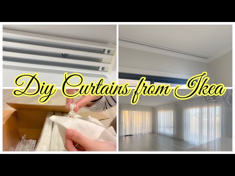 Part of a video titled How To Hang Curtains From Ceiling to Floor | DIY | Vidga Track Rail