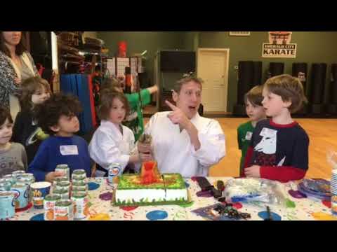 Tavi cuts the cake Samurai style