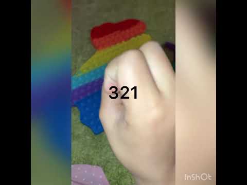 Me playing with my big Dinosaur pop it and Unicorn￼ Rainbow pop it￼