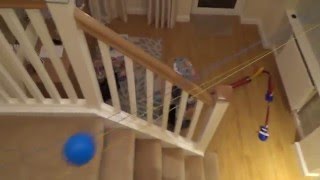 Homemade MARBLE RUN using telephone wire, plastic golf ball and a domino set.