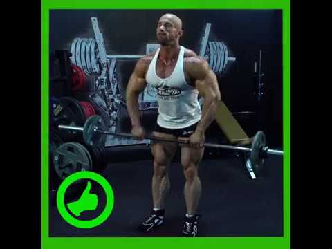Najlepsze ćwiczenia na barki - Podciąganie sztangi wzdłuż tułowia - Olimp Sport Nutrition