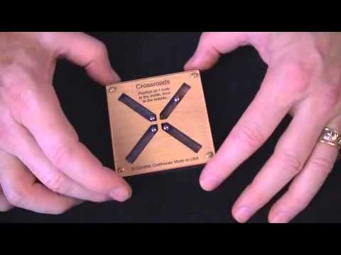 Crossroads puzzle - position balls to the inside then to the outside of the X