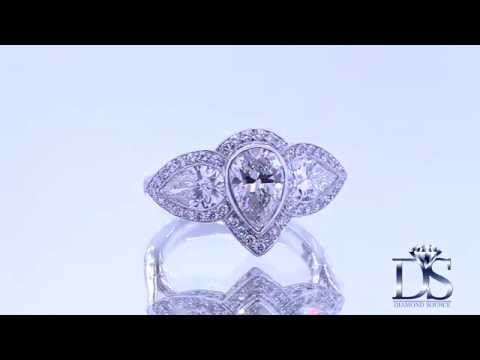 Beautiful platinum three stone engagement ring with 1 24CT pear shape diamond EN 32500