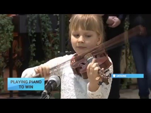 Playing Piano to Win: Young Ukrainian musicians participate in improvised concert