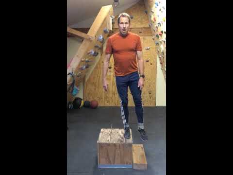 Coach demonstrating a box step-off, from the Uphill Athlete strength demo