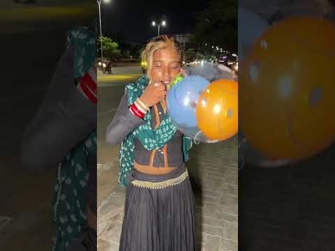 A beautiful girl's amazing balloon-inflating skill.